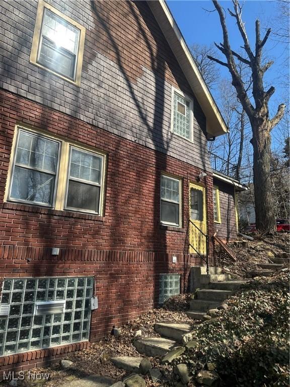 view of home's exterior featuring brick siding