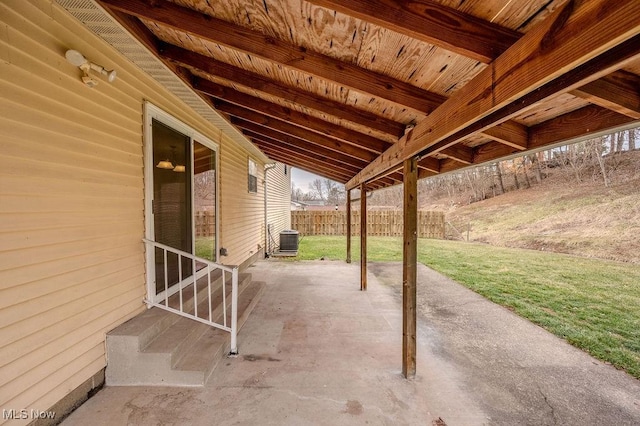 view of patio with central AC unit and fence