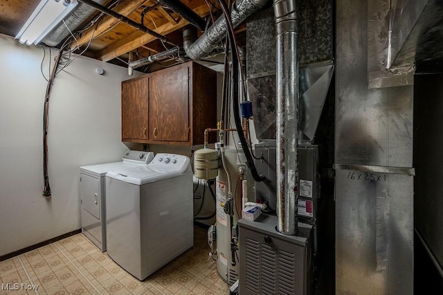 clothes washing area featuring washing machine and dryer and light floors