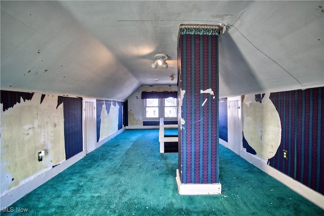 bonus room featuring lofted ceiling and carpet floors