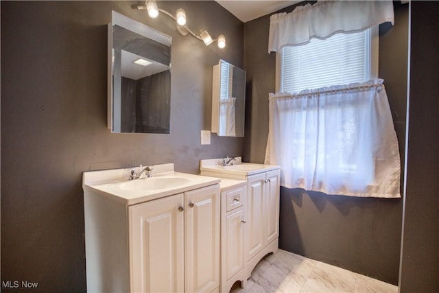 full bath featuring marble finish floor and vanity