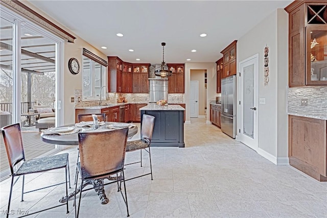 dining area featuring recessed lighting and baseboards