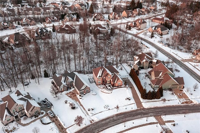 snowy aerial view featuring a residential view