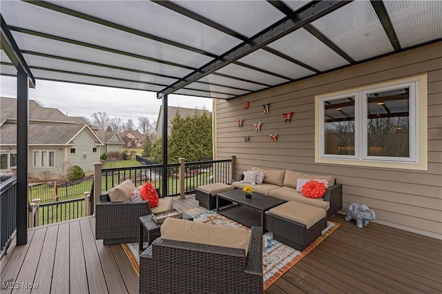 deck featuring a pergola and an outdoor hangout area