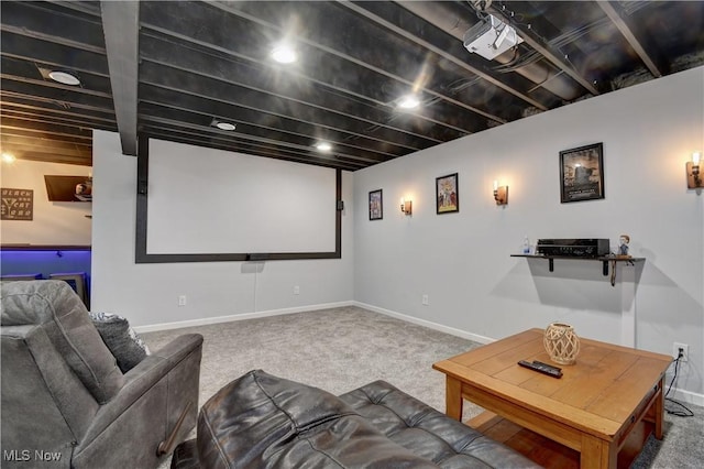 cinema room featuring carpet flooring and baseboards