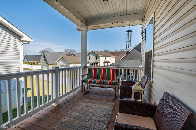 wooden terrace featuring a residential view