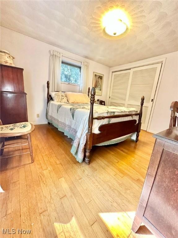 bedroom with light wood finished floors