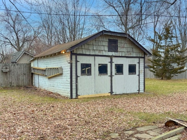 view of outdoor structure with an outdoor structure and fence