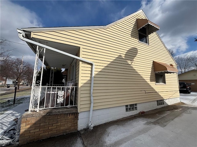 view of home's exterior with a porch