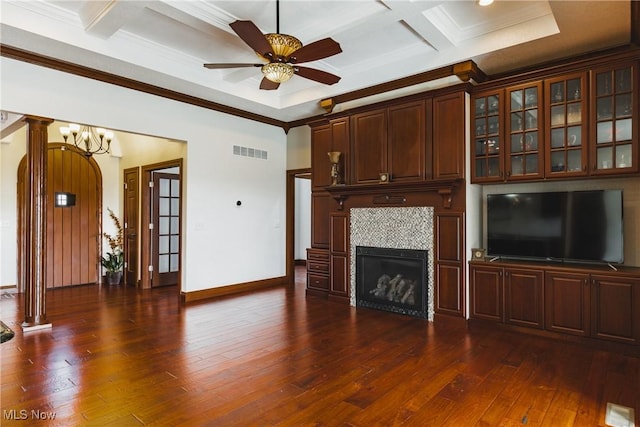 unfurnished living room with dark wood-type flooring, coffered ceiling, visible vents, and crown molding