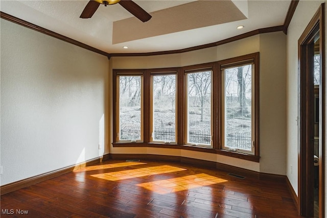 spare room with recessed lighting, visible vents, baseboards, wood-type flooring, and crown molding