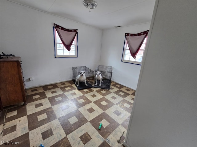 interior space with visible vents and tile patterned floors