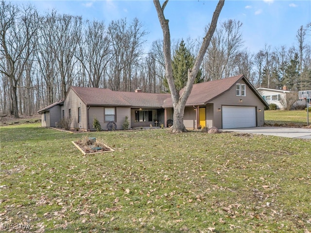 view of front of property with a garage, a chimney, concrete driveway, and a front yard