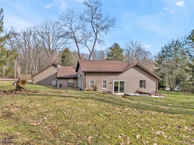 rear view of house with a lawn