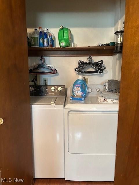 laundry room with washer and dryer and laundry area