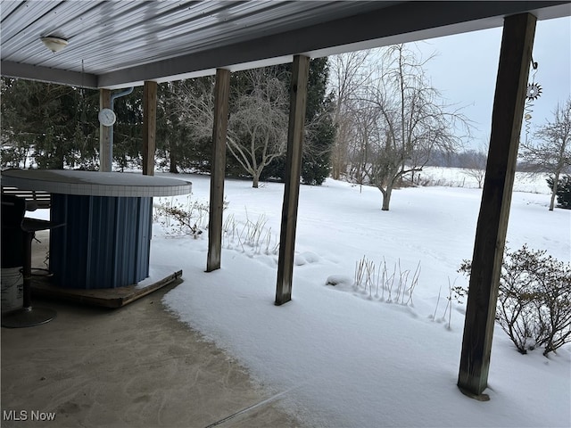 view of yard layered in snow