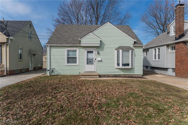 view of front of property featuring driveway, a shingled roof, and entry steps