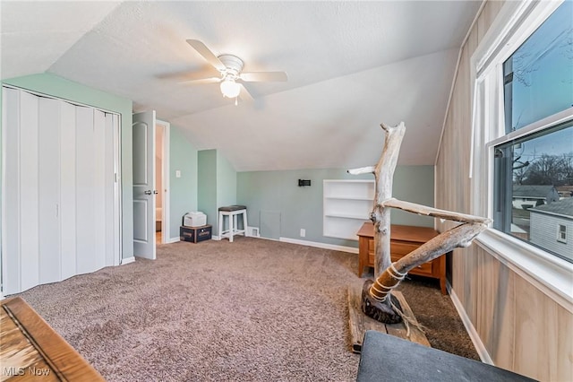 additional living space with vaulted ceiling, ceiling fan, carpet, and baseboards