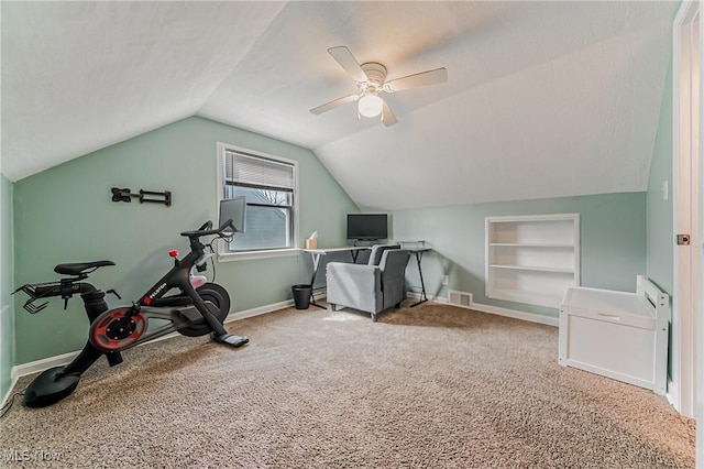 workout area with built in shelves, carpet, lofted ceiling, a ceiling fan, and baseboards