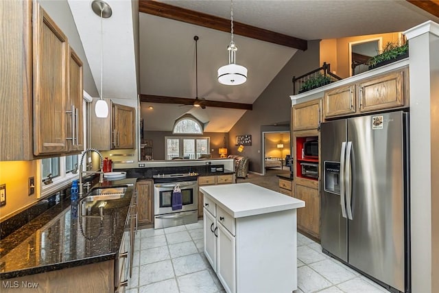 kitchen with brown cabinets, beamed ceiling, a peninsula, stainless steel appliances, and a sink