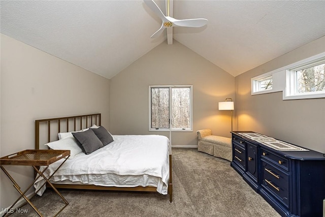 carpeted bedroom with a ceiling fan, vaulted ceiling, and a textured ceiling