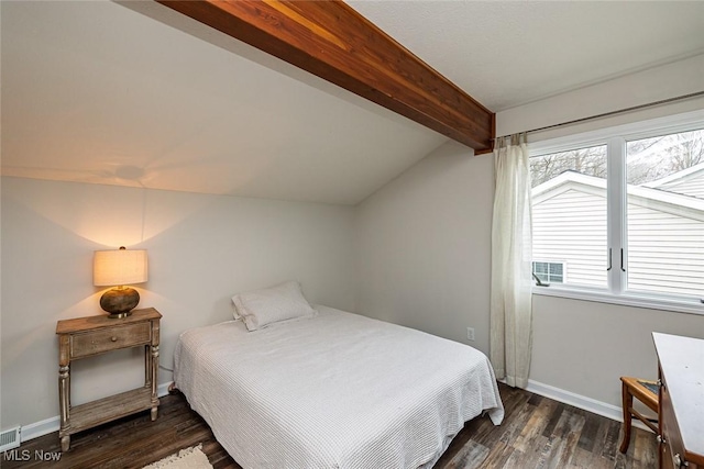 bedroom with vaulted ceiling with beams, visible vents, baseboards, and wood finished floors