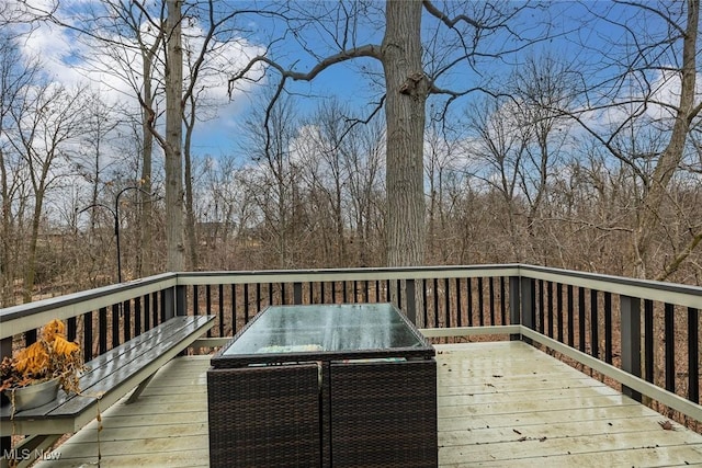 wooden deck with outdoor dining space