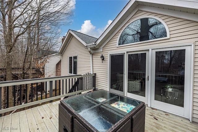 deck featuring a hot tub