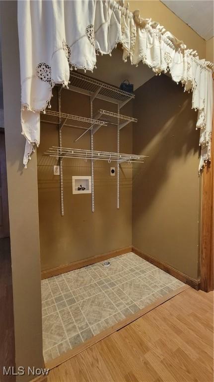 spacious closet featuring wood finished floors