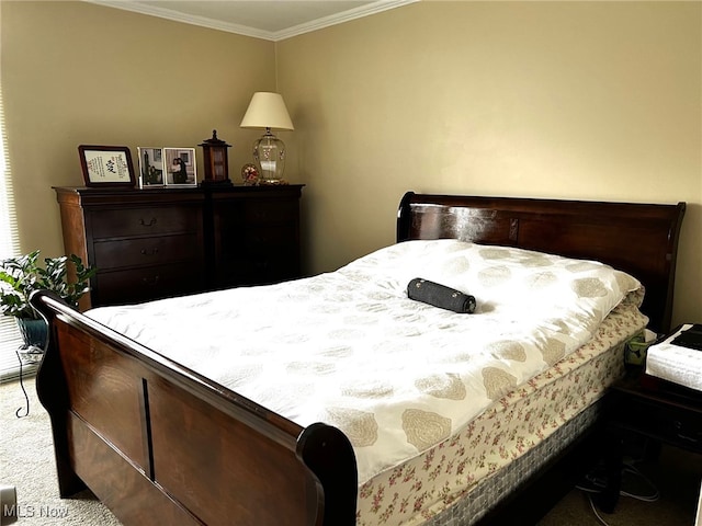 bedroom with ornamental molding and light colored carpet