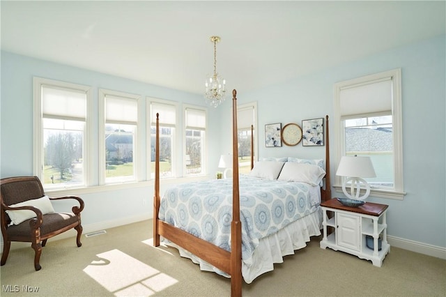 bedroom featuring baseboards, a notable chandelier, visible vents, and carpet flooring