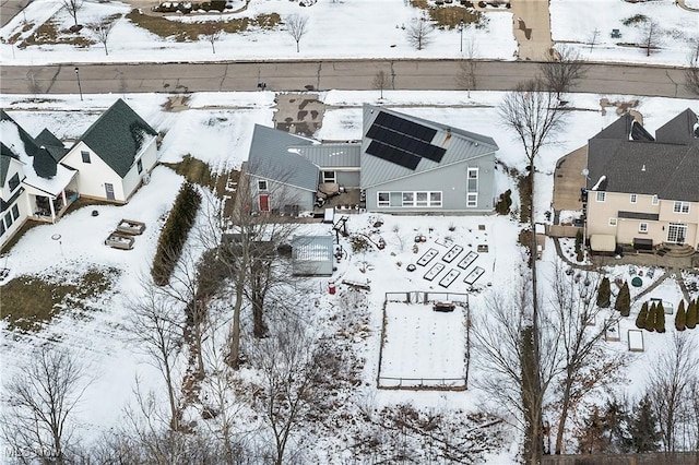 snowy aerial view featuring a residential view