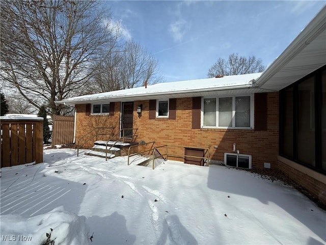 exterior space featuring crawl space and brick siding