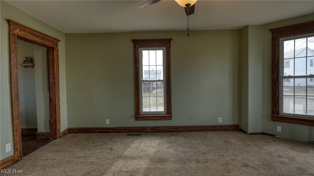 456 Carl St, Cumberland, OH 43732 - carpeted empty room with baseboards, a ceiling fan, and plenty of natural light