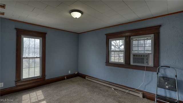 unfurnished room with a textured wall, a baseboard radiator, crown molding, cooling unit, and carpet floors