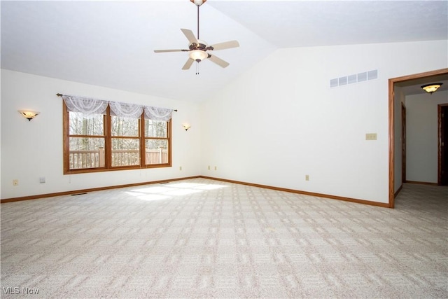 unfurnished room featuring carpet floors, lofted ceiling, visible vents, and baseboards