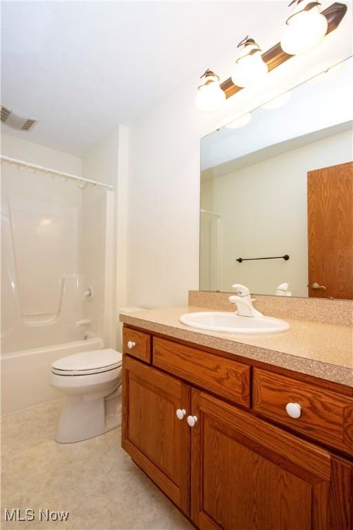 full bath with toilet, shower / washtub combination, vanity, and visible vents