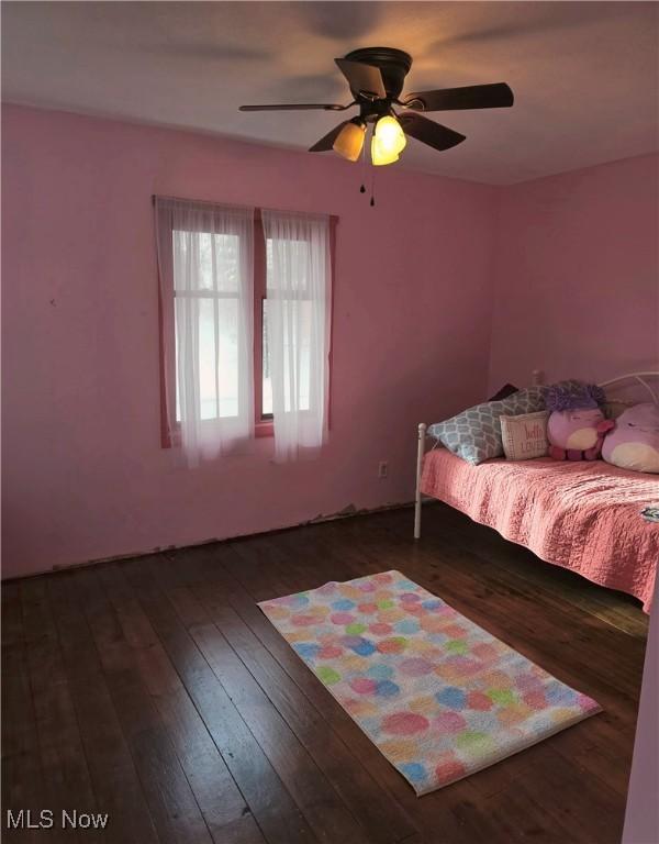 bedroom with ceiling fan and wood-type flooring