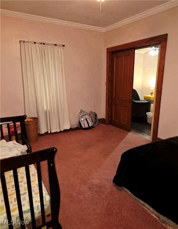 carpeted bedroom with ornamental molding