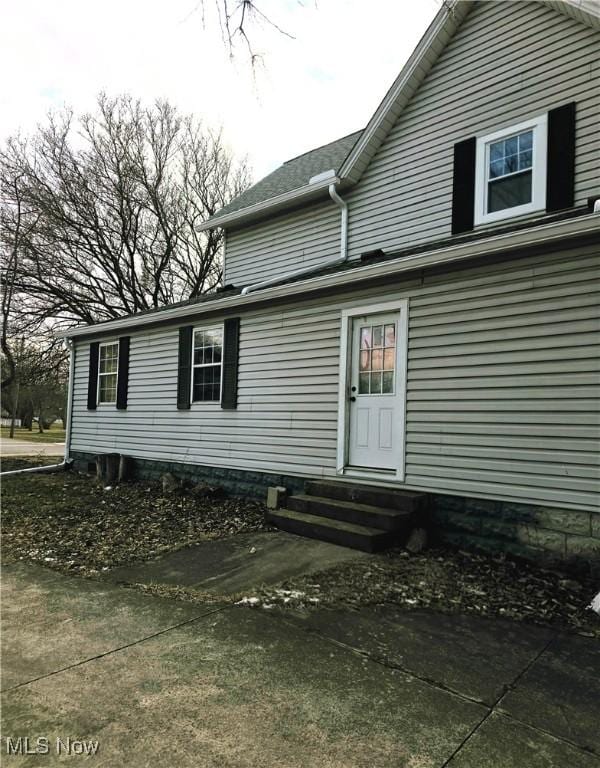 rear view of house with entry steps