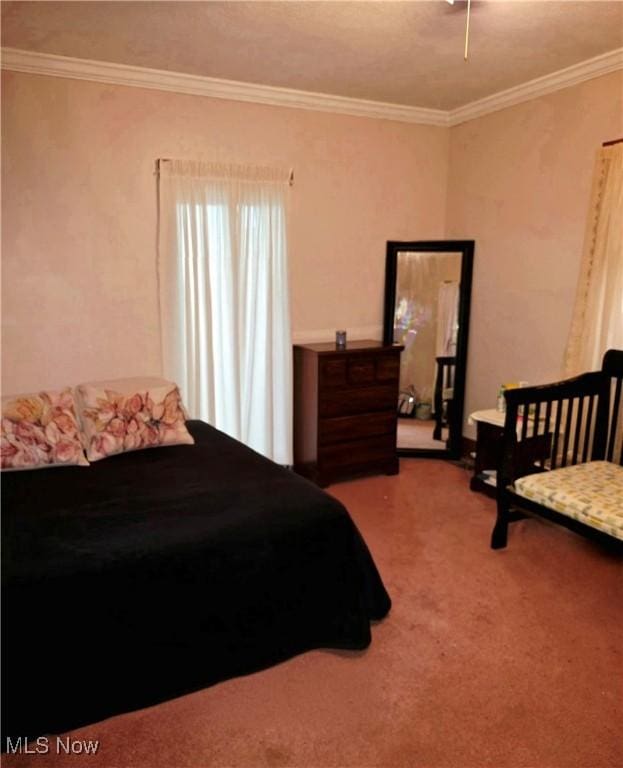 carpeted bedroom featuring crown molding