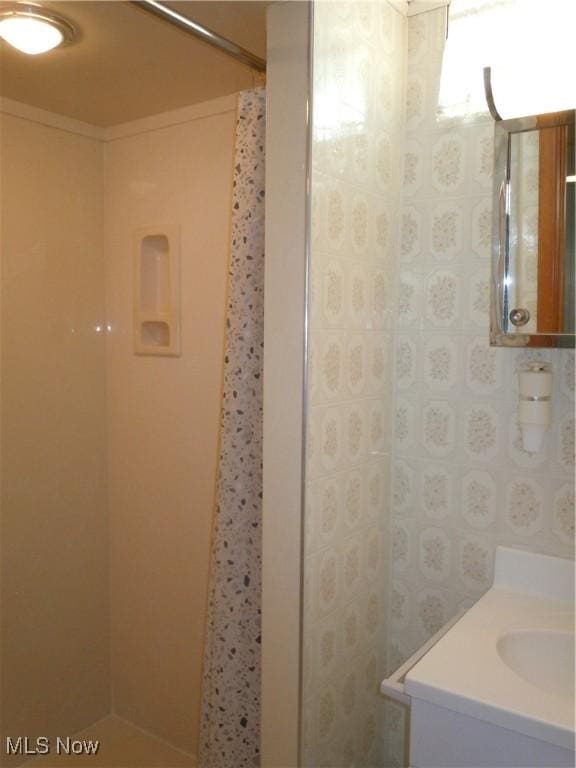 bathroom with vanity and walk in shower