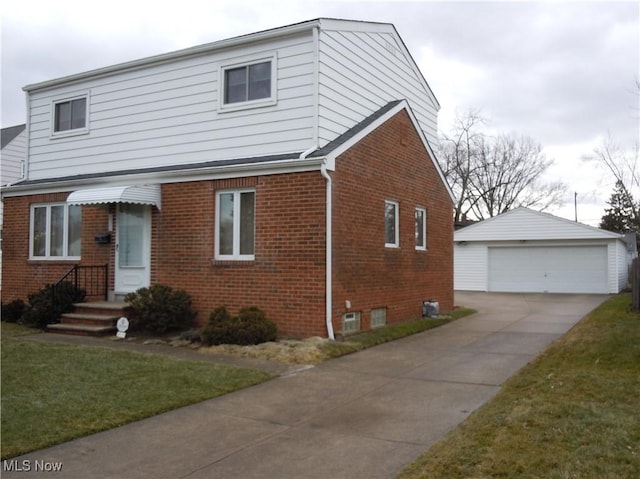 view of front facade featuring a garage, brick siding, a front lawn, and an outdoor structure