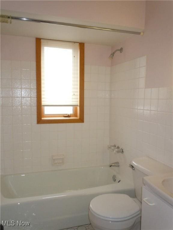 full bathroom featuring shower / bathtub combination, vanity, and toilet