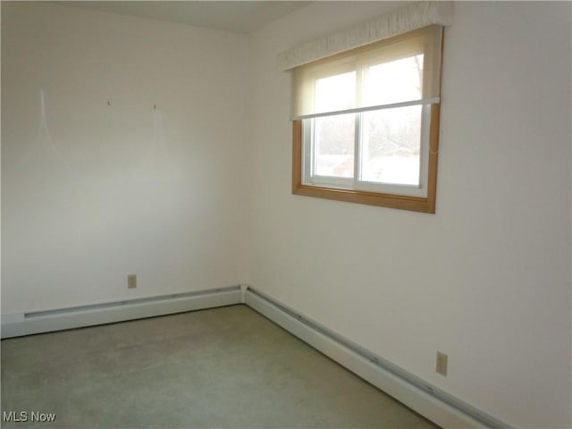 unfurnished room with light carpet and baseboard heating