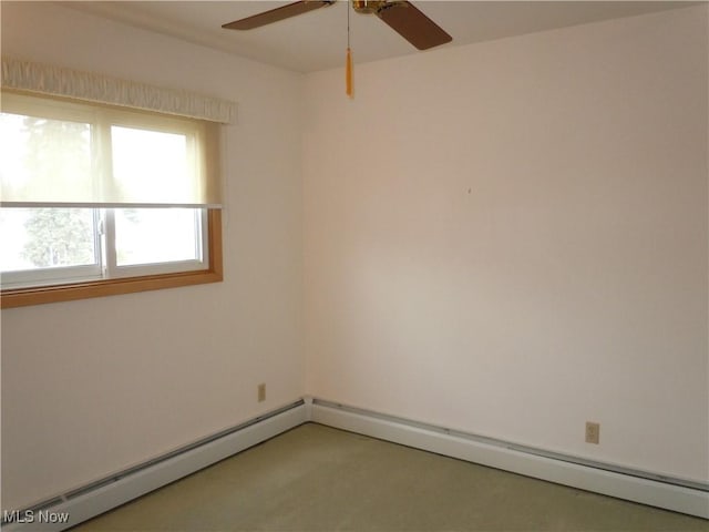 empty room featuring ceiling fan and baseboard heating