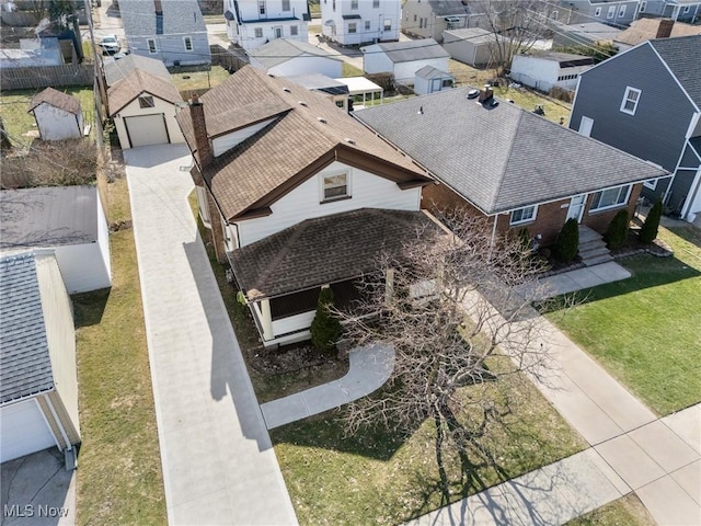 birds eye view of property with a residential view