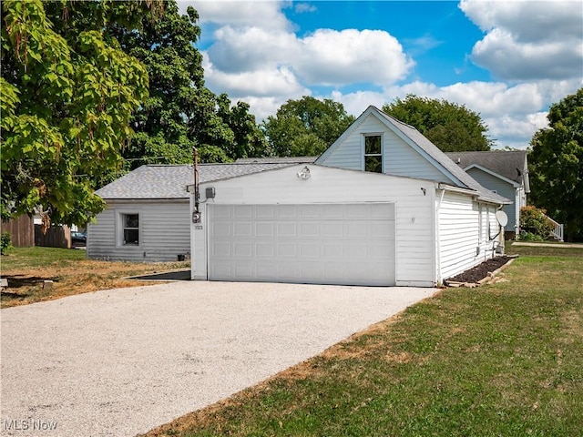 garage with aphalt driveway