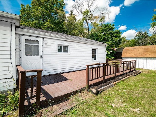 wooden terrace with a yard