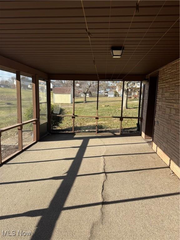 unfurnished sunroom with a wealth of natural light